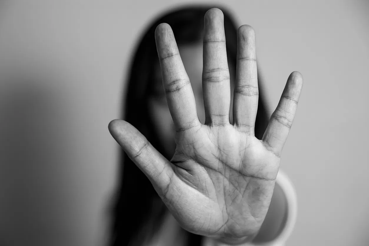 woman raised her hand for dissuade